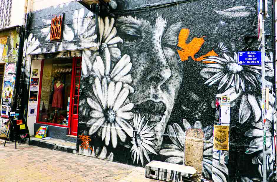 Rue Bussy L'Indien Marseille street art black and white mural of a woman