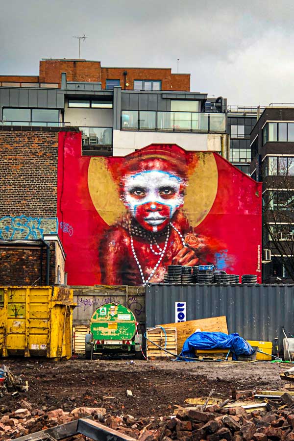 street art in Manchester by Dale Grimshaw portrait of an indigenous person of New Guinea