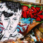 stencil artwork by Zabou of a boy picking his nose in Raw Gelände, one of the best places to see street art in Berlin