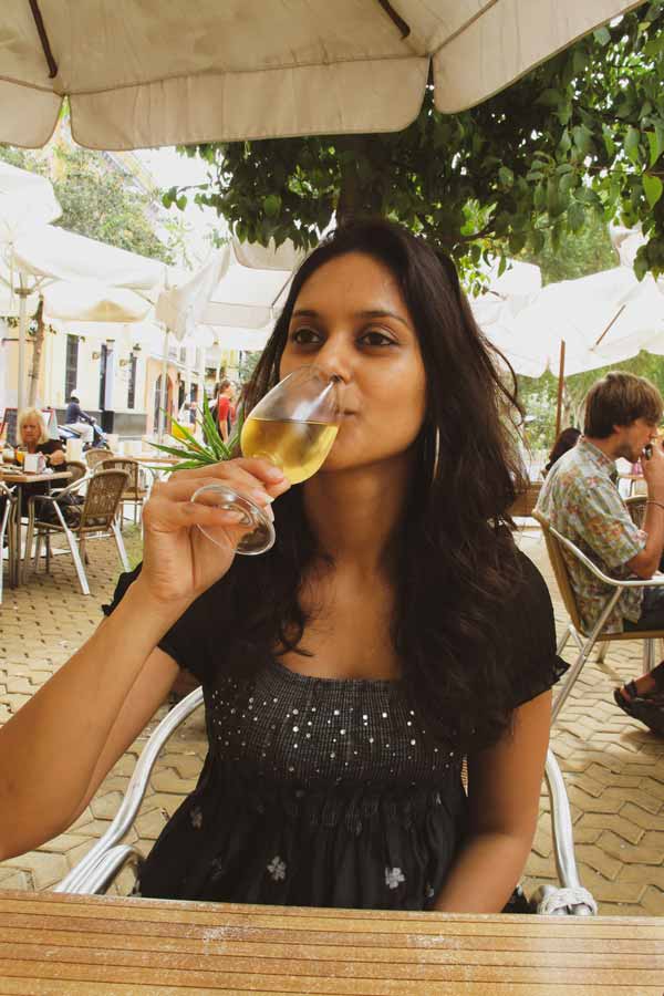 Zarina drinking a glass of Manzanilla sherry