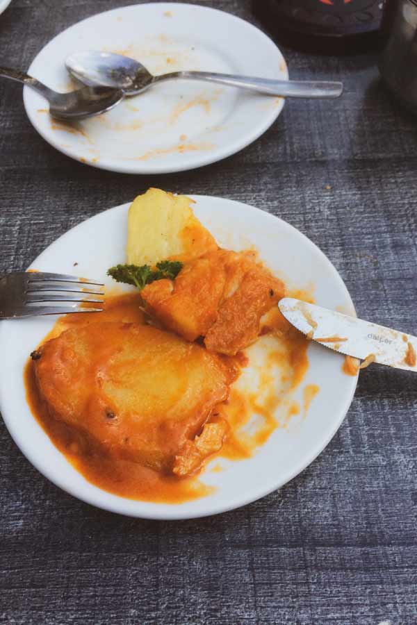 Thick slices of potato in tomato sauce at tapas restaurant Dos de Mayo, Seville